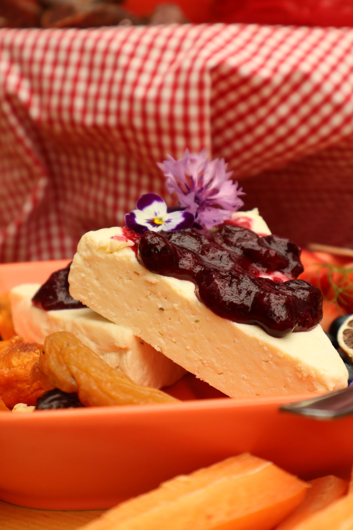 Slices of Crafted Dairy cheese topped with berry preserve