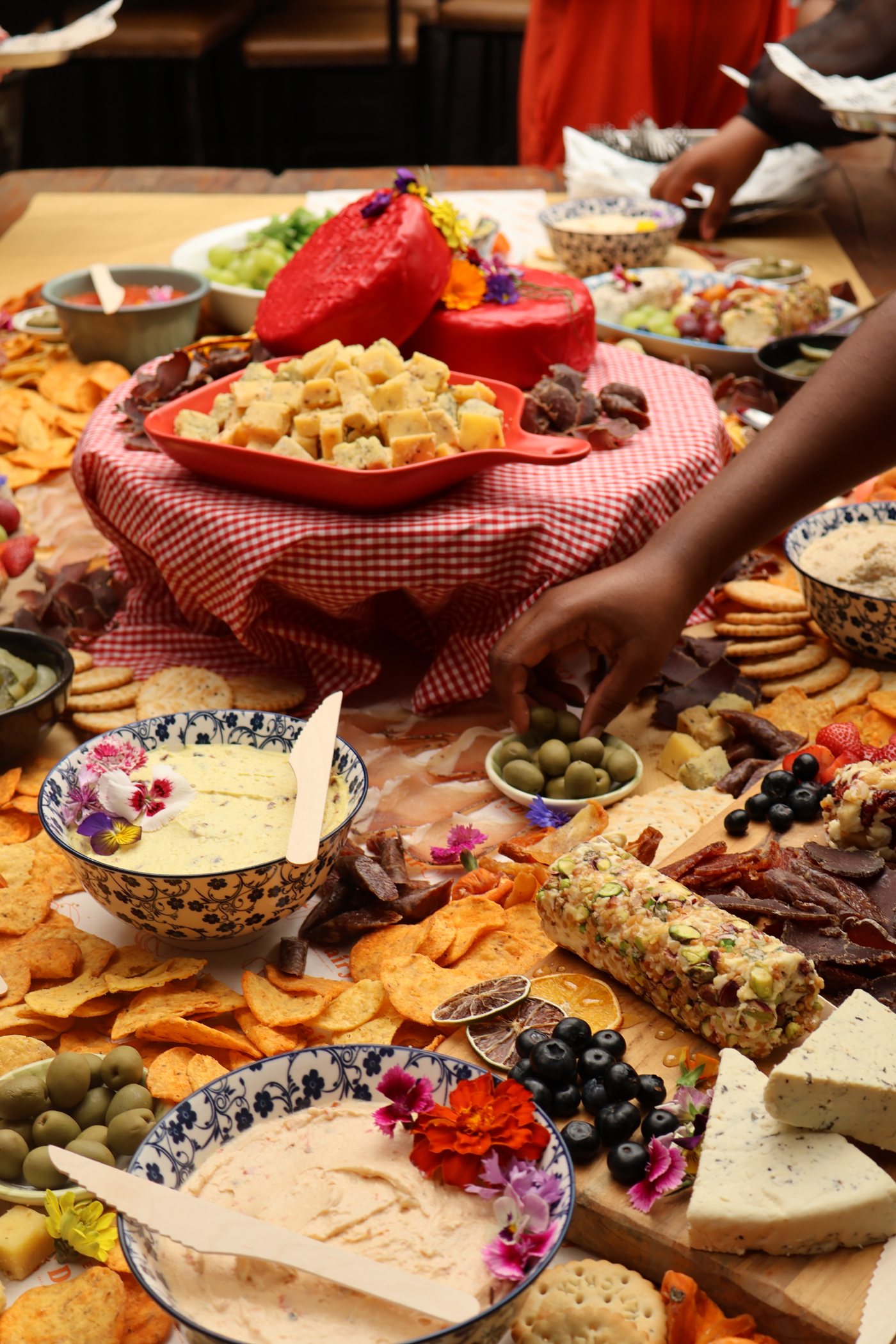 Guests helping themselves at a Crafted Dairy catered grazing table